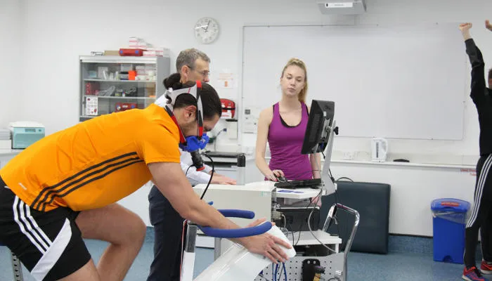Man on an exercise bike in the exercise psychology laboratory
