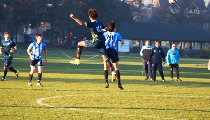 Students playing football at the Teddington Lock campus
