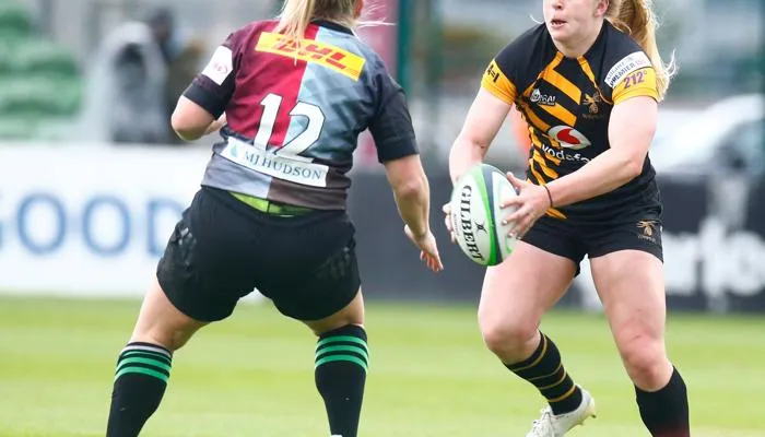 Emile Cairess and Abi Burton competing in rugby