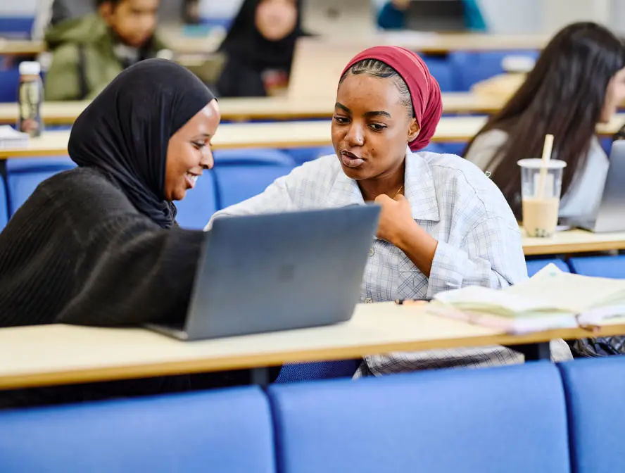 Students talking in a lecture hall