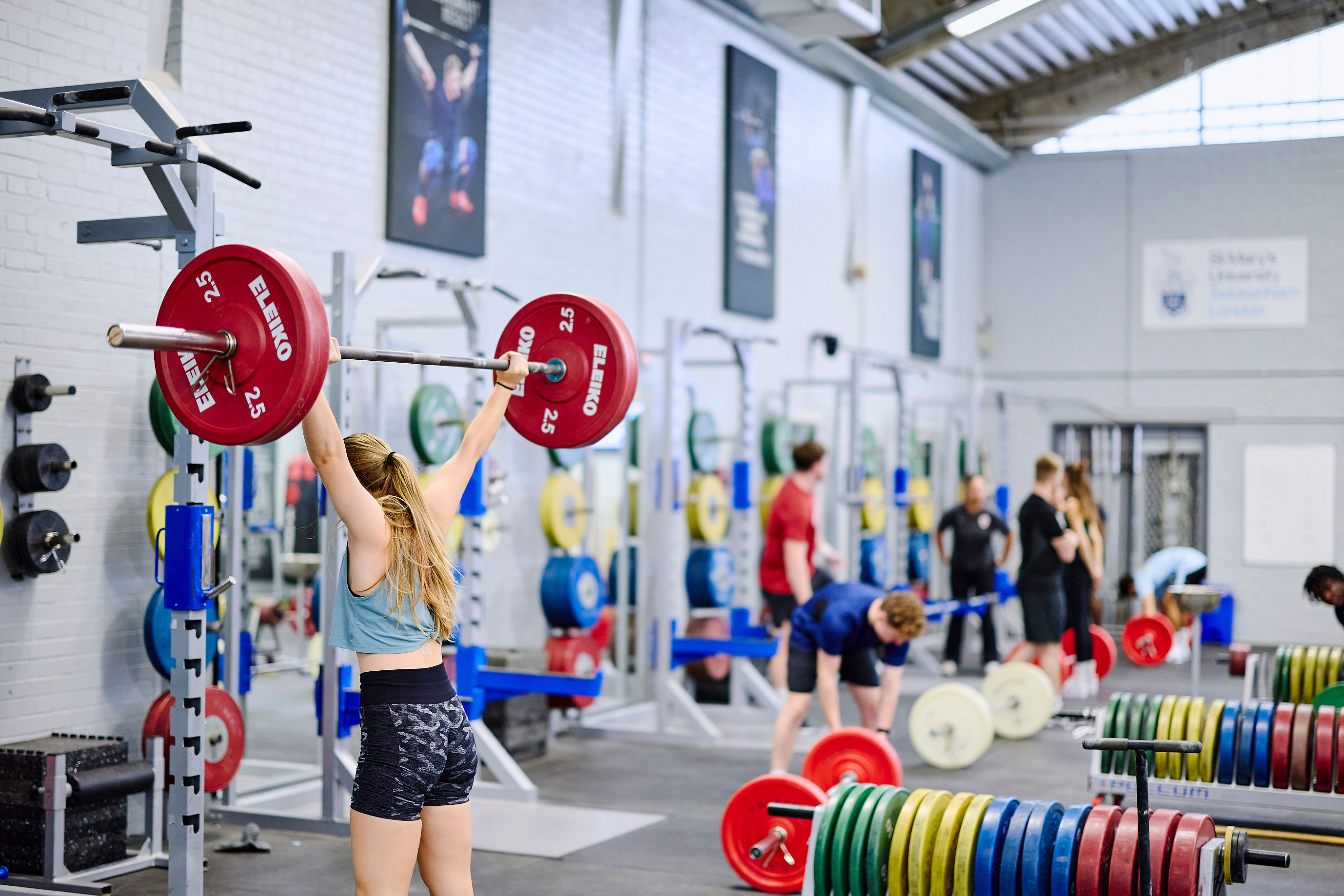 female sports student lifting