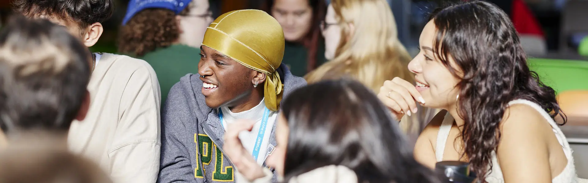 Students laugh and chat.