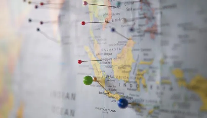 Colourful pins mark a map of South East Asia.