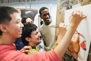 Students painting together.