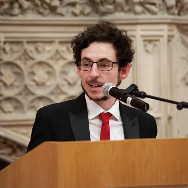 Conal Baxter speaking at an event.